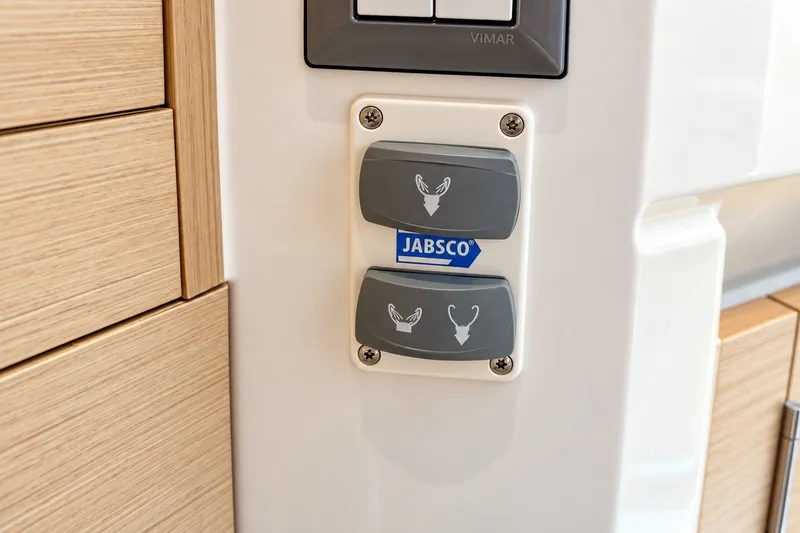 Slide: The Image of Jabsco control panel on 2024 Beneteau Oceanis 34.1 yacht interior. - 12