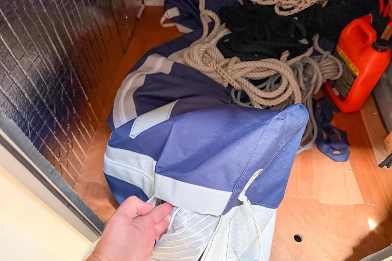 Slide: The Image of Storage compartment with ropes and gear on a 2024 Beneteau Oceanis 34.1 sailboat. - 14