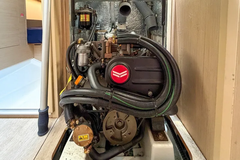 Slide: The Image of Engine compartment of 2024 Beneteau Oceanis 34.1 sailboat, showcasing detailed mechanical components. - 28