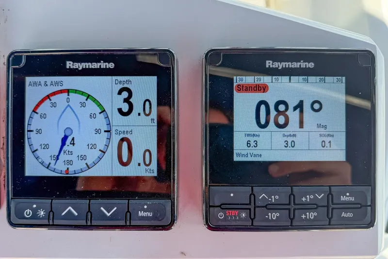 Slide: The Image of Raymarine navigation displays on a 2024 Beneteau Oceanis 34.1 sailboat, showing depth and speed. - 39