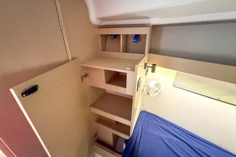 Slide: The Image of Interior storage and lighting in 2024 Beneteau Oceanis 34.1 yacht cabin. - 24