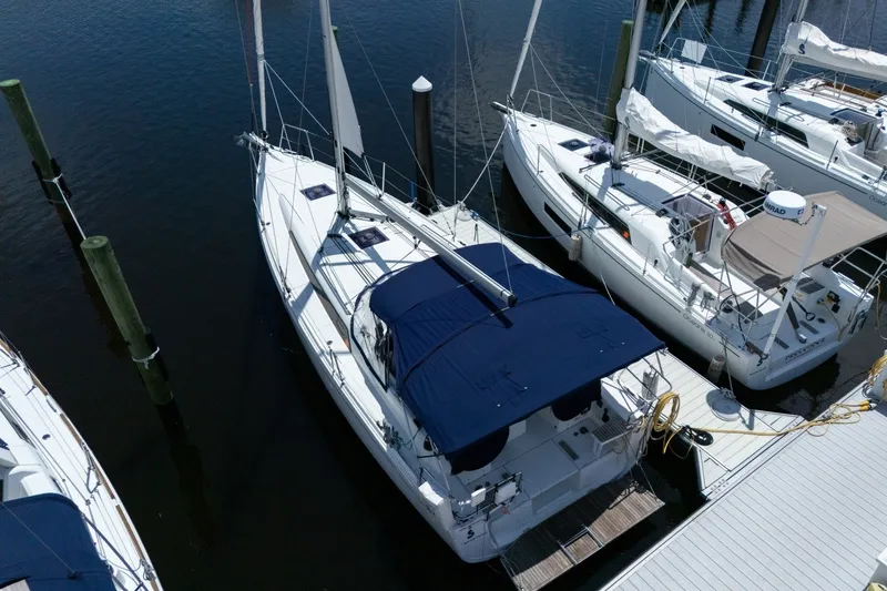 Slide: The Image of 2024 Beneteau Oceanis 34.1 sailboat docked at marina, aerial view. - 50