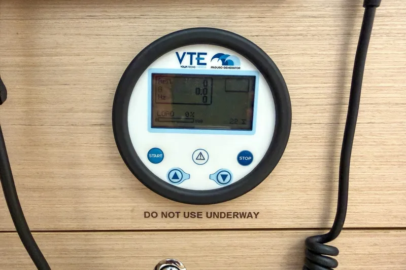Slide: The Image of Control panel on 2024 Beneteau Oceanis 34.1 sailboat, displaying generator settings. - 22