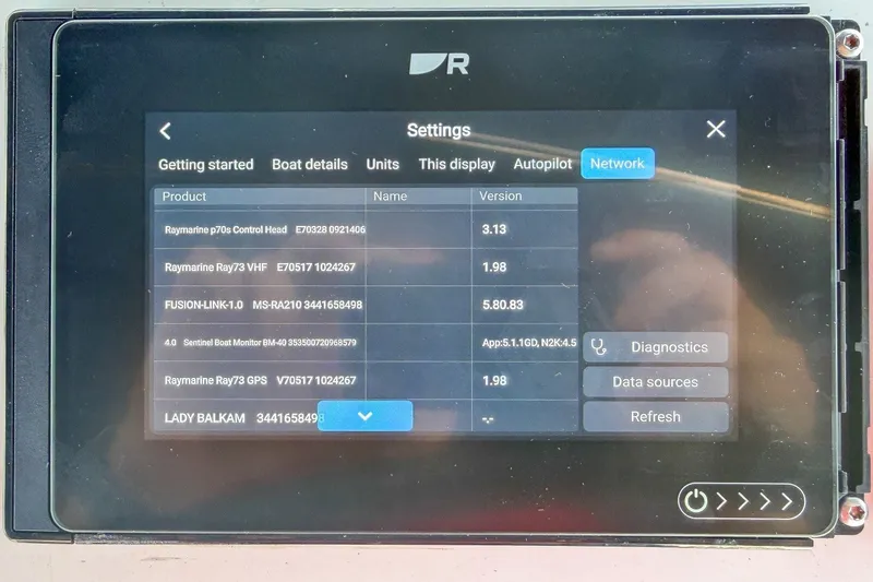 Slide: The Image of Boat network settings display on Beneteau Oceanis 34.1, 2024 model, showing device versions. - 38