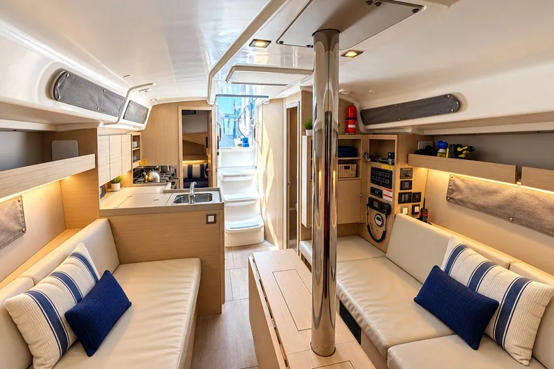 Slide: The Image of Luxurious interior of 2024 Beneteau Oceanis 34.1 yacht with modern furnishings and kitchen. - 24