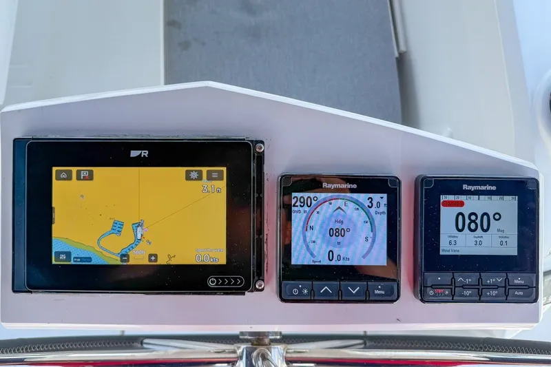 Slide: The Image of Navigation instruments on a 2024 Beneteau Oceanis 34.1 yacht dashboard. - 36
