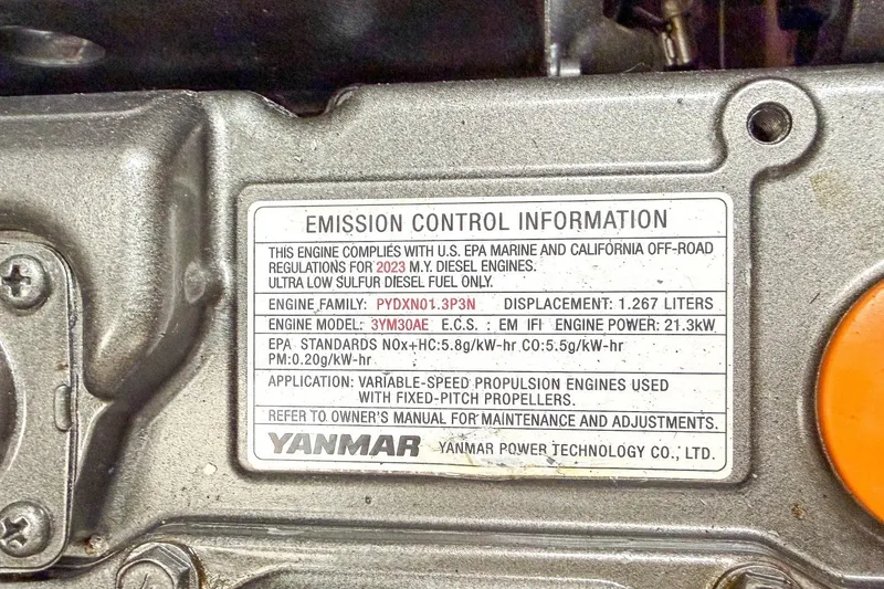 Slide: The Image of Emission control label on Yanmar engine for 2024 Beneteau Oceanis 34.1 sailboat. - 29