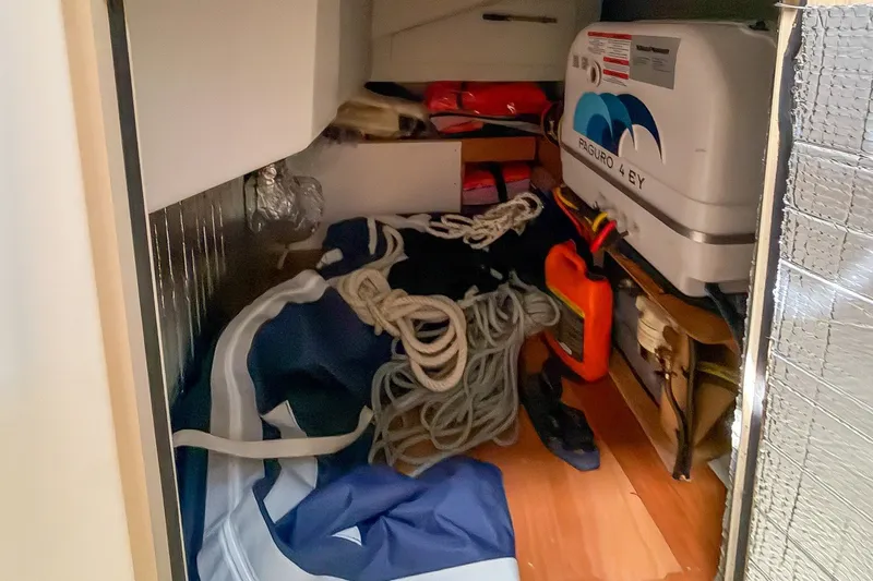 Slide: The Image of Storage compartment in a 2024 Beneteau Oceanis 34.1 yacht with ropes and equipment. - 13