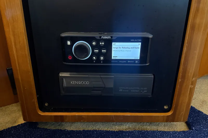 Slide: The Image of Fusion and Kenwood audio systems in a 2002 Carver 404 Cockpit Motor Yacht. - 65