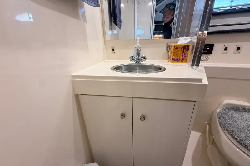 Slide: The Image of Bathroom sink area in a 2002 Carver 404 Cockpit Motor Yacht. - 51