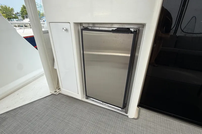 Slide: The Image of Stainless steel refrigerator on 2002 Carver 404 Cockpit Motor Yacht deck. - 18