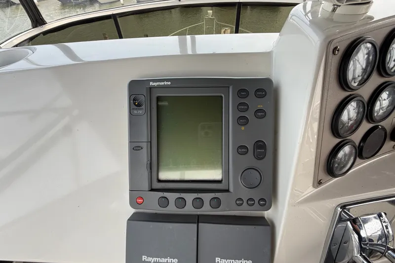 Slide: The Image of Raymarine navigation system on 2002 Carver 404 Cockpit Motor Yacht dashboard. - 27