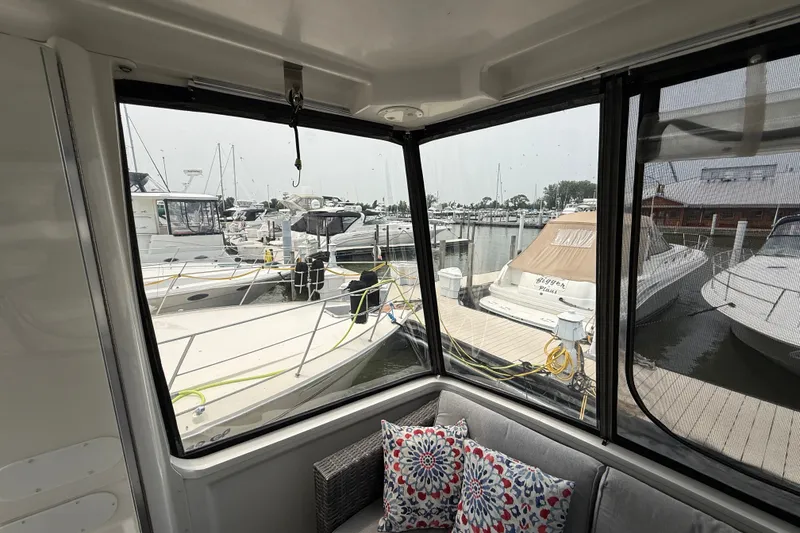 Slide: The Image of View from 2002 Carver 404 Cockpit Motor Yacht, overlooking marina with boats and docks. - 12