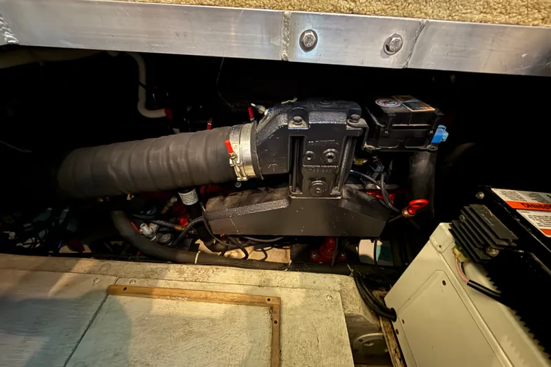 Slide: The Image of Engine compartment of a 2002 Carver 404 Cockpit Motor Yacht, showcasing mechanical components. - 67