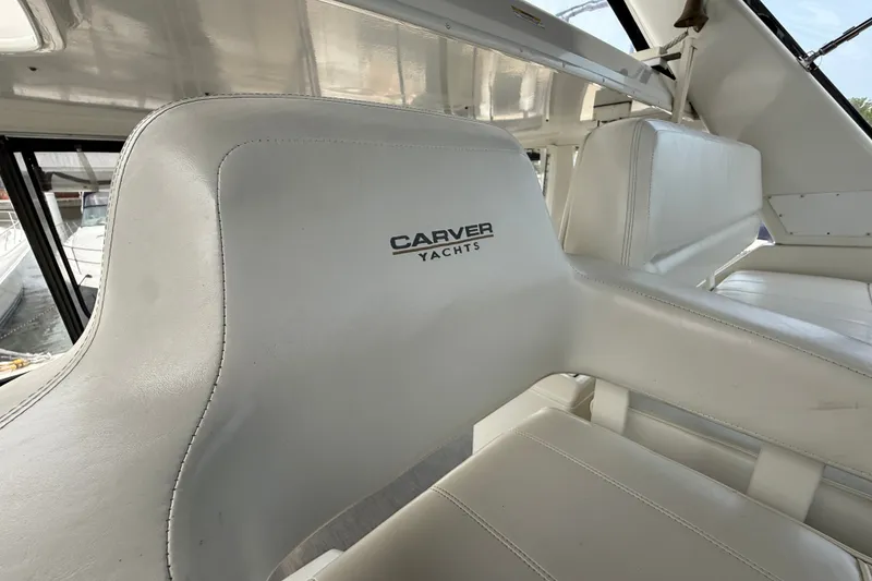 Slide: The Image of White leather seating on a 2002 Carver 404 Cockpit Motor Yacht. - 22