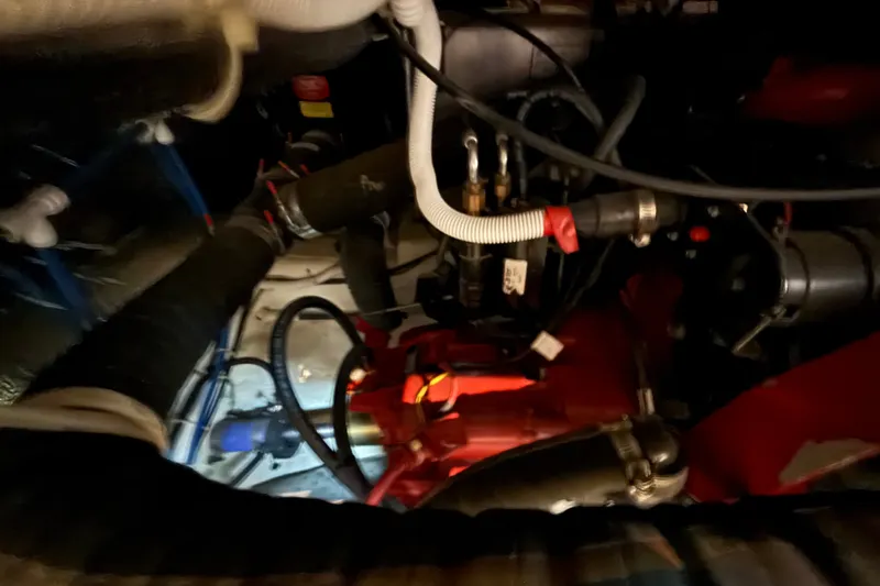 Slide: The Image of Engine room of a 2002 Carver 404 Cockpit Motor Yacht, showcasing mechanical components. - 68