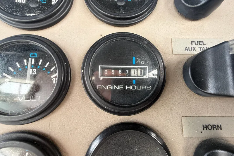 Slide: The Image of Close-up of 2002 Carver 404 Cockpit Motor Yacht engine hour meter showing 587 hours. - 29