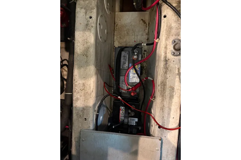 Slide: The Image of Battery compartment of a 2002 Carver 404 Cockpit Motor Yacht with visible wiring. - 72