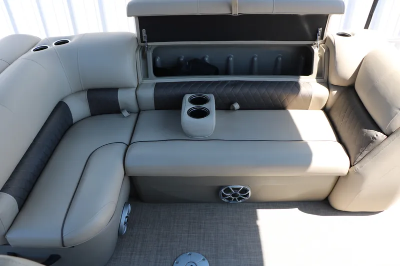 Slide: The Image of 2025 Sun Tracker SportFish 20 DLX boat interior with cushioned seating and cup holders. - 41