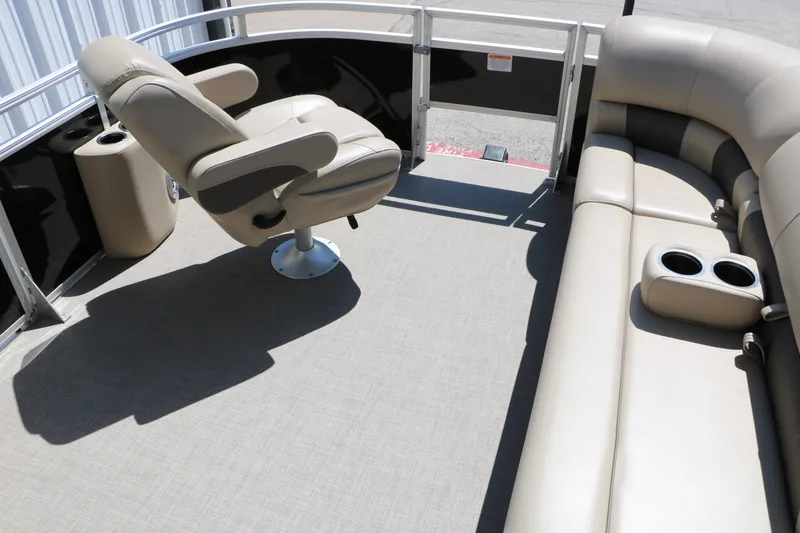 Slide: The Image of 2025 Sun Tracker SportFish 20 DLX interior with beige seating and cup holders. - 34