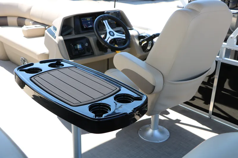 Slide: The Image of Interior of 2025 Sun Tracker SportFish 20 DLX boat with steering console and seating. - 22