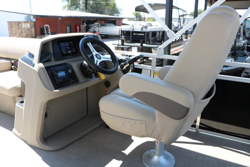 Slide: The Image of 2025 Sun Tracker SportFish 20 DLX boat interior with steering console and captain's chair. - 38