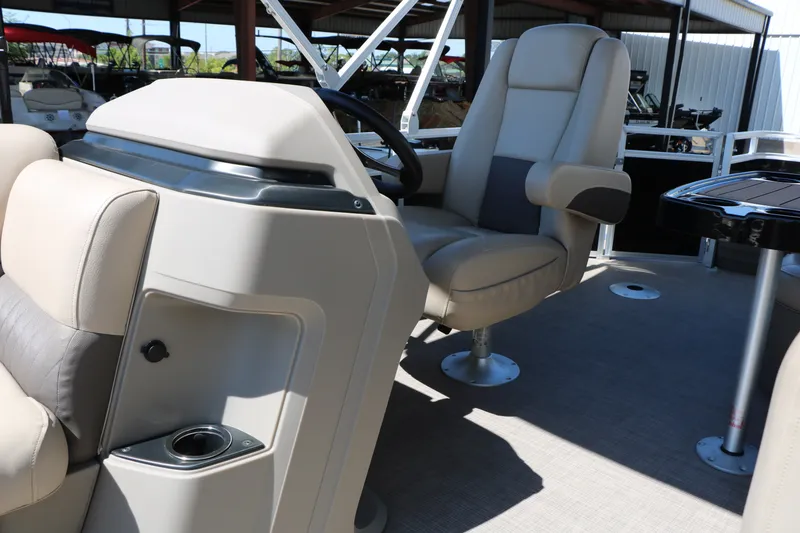 Slide: The Image of 2025 Sun Tracker SportFish 20 DLX boat interior with comfortable seating and steering console. - 29