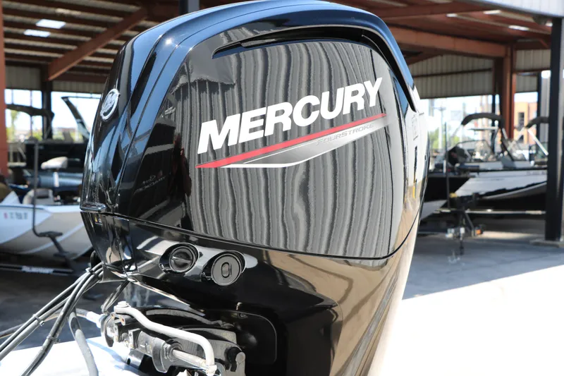 Slide: The Image of Mercury outboard motor on a 2025 Sun Tracker SportFish 20 DLX boat in a marina. - 45