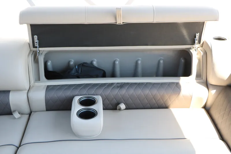 Slide: The Image of 2025 Sun Tracker SportFish 20 DLX boat seat storage with cup holders and quilted upholstery. - 42