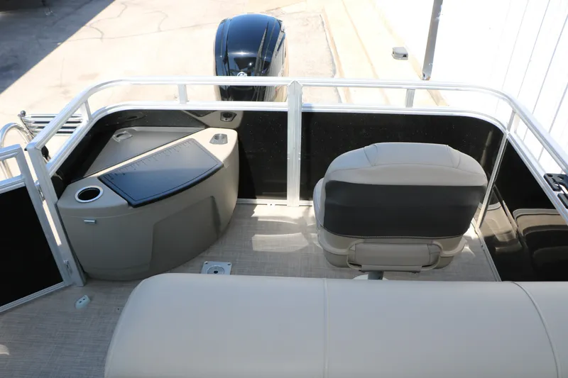 Slide: The Image of 2025 Sun Tracker SportFish 20 DLX boat interior with seating and storage area. - 36