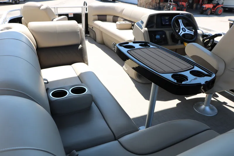 Slide: The Image of 2025 Sun Tracker SportFish 20 DLX interior with plush seating and modern dashboard. - 21