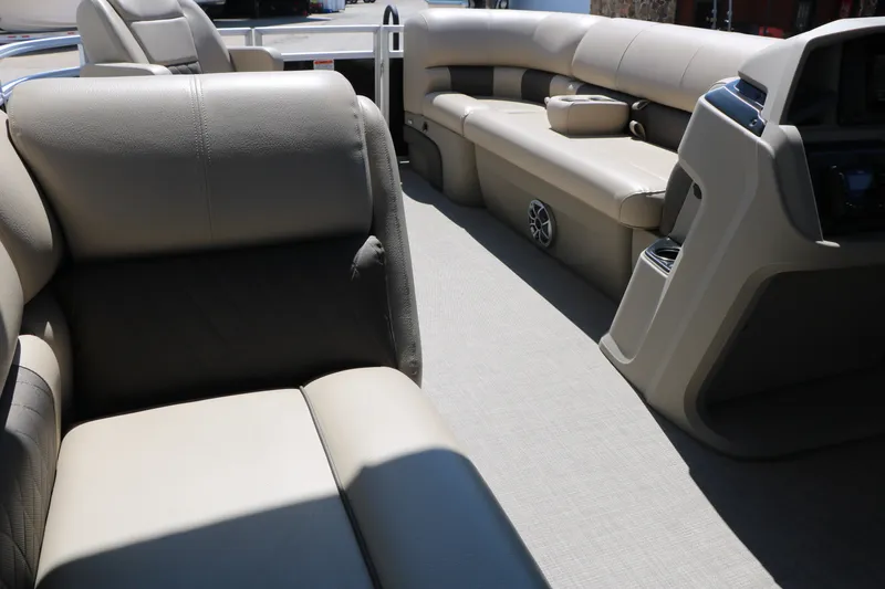 Slide: The Image of 2025 Sun Tracker SportFish 20 DLX interior with beige seating and modern console design. - 40