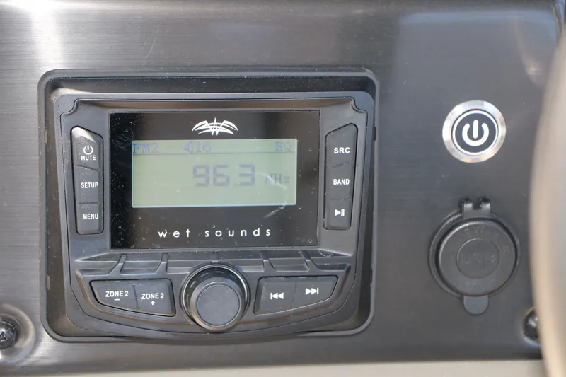 Slide: The Image of Wet Sounds audio system on 2025 Sun Tracker SportFish 20 DLX, displaying FM frequency 96.3 MHz. - 26