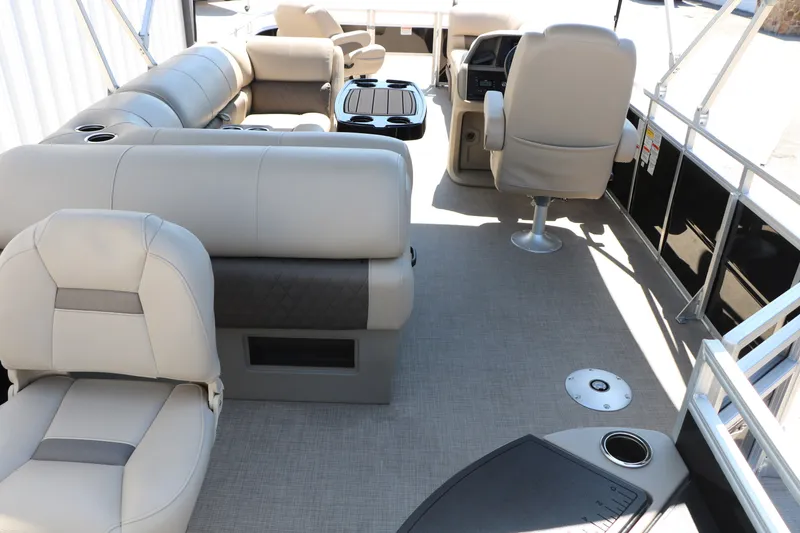 Slide: The Image of 2025 Sun Tracker SportFish 20 DLX pontoon boat interior with plush seating and modern design. - 16