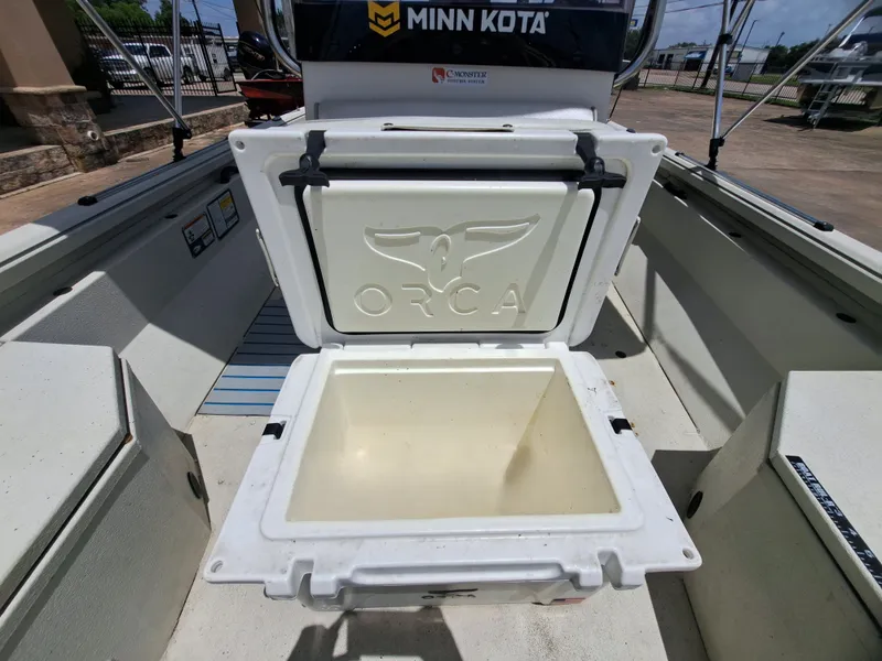 Slide: The Image of An open Orca cooler inside a 2022 Ranger RB190 boat. - 20
