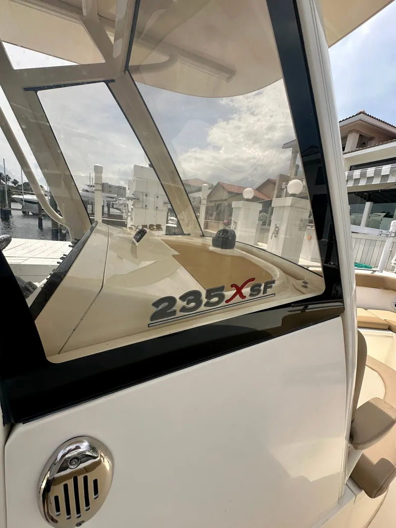 Slide: The Image of 2019 Scout 235 XSF with sleek design and spacious cockpit, perfect for coastal cruising. - 6
