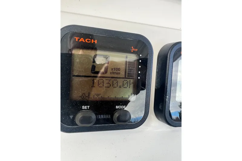 Slide: The Image of Yamaha tachometer display on 2008 Edgewater 318CC boat showing 1030.0 hours. - 17