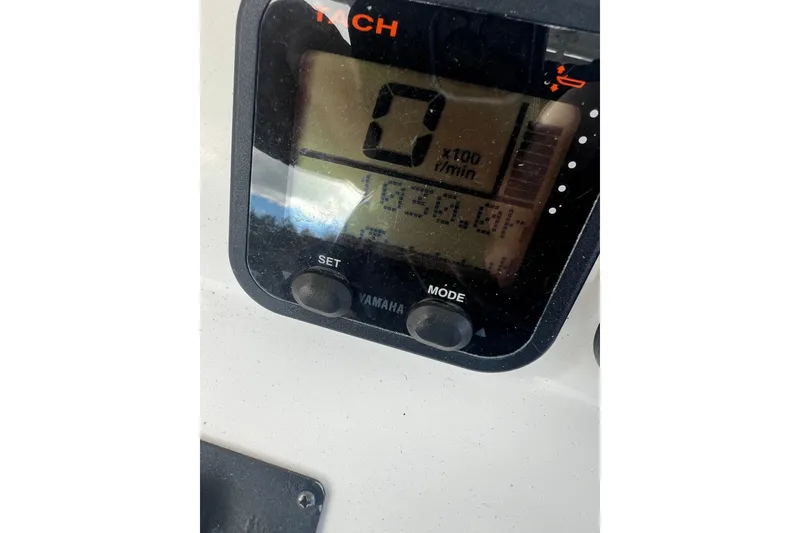 Slide: The Image of Digital tachometer display on a 2008 Edgewater 318CC boat, showing engine hours. - 18