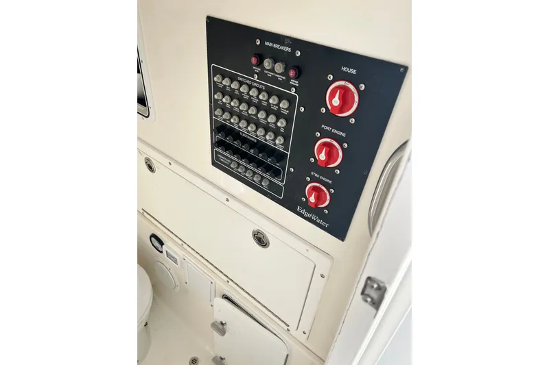 Slide: The Image of Electrical panel of a 2008 Edgewater 318CC boat with switches and controls. - 9