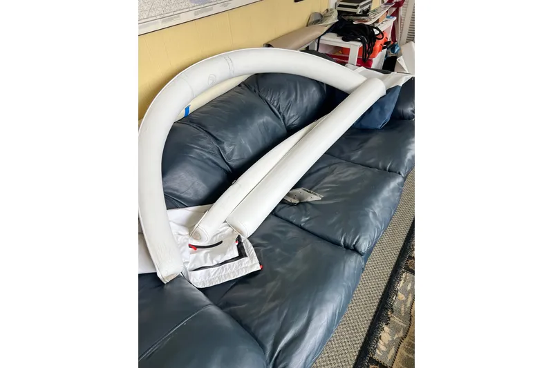 Slide: The Image of Inflatable boat accessory on a blue leather couch, Edgewater 318CC, 2008 model. - 7