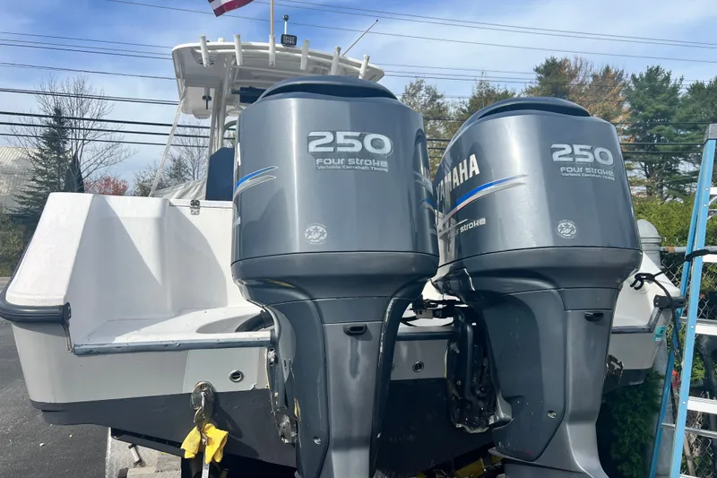 Slide: The Image of 2008 Edgewater 318CC boat with dual Yamaha 250 four-stroke outboard engines. - 5