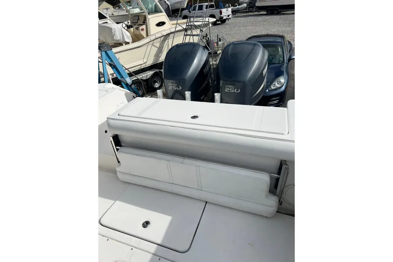 Slide: The Image of 2008 Edgewater 318CC boat with Yamaha 250 engines, docked in a marina. - 8