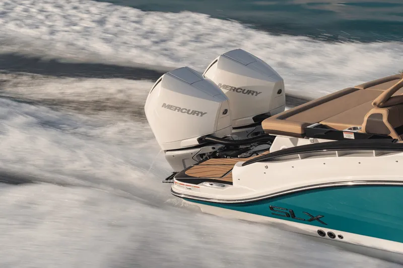 Slide: The Image of The image shows a Sea Ray SLX 280 Outboard boat with two Mercury outboard engines. - 7