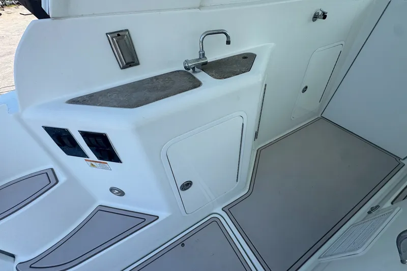 Slide: The Image of 2009 Cruisers Yachts 390 Sports Coupe interior with sink and storage compartments. - 16