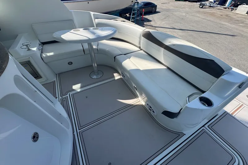 Slide: The Image of 2009 Cruisers Yachts 390 Sports Coupe interior with white seating and table. - 11
