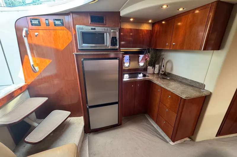 Slide: The Image of Luxurious 2009 Cruisers Yachts 390 Sports Coupe interior with modern kitchen amenities. - 20