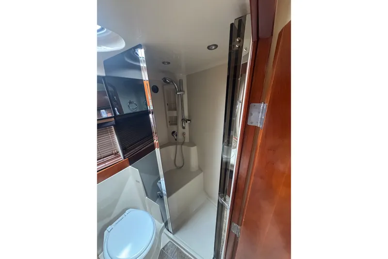 Slide: The Image of Bathroom interior of 2009 Cruisers Yachts 390 Sports Coupe with shower and toilet. - 22