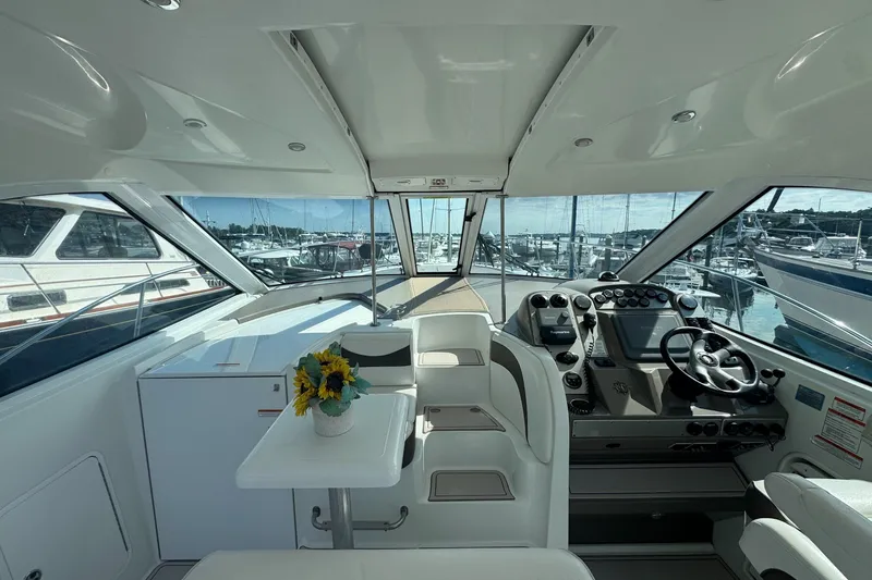 Slide: The Image of Interior of 2009 Cruisers Yachts 390 Sports Coupe with helm and seating area. - 10