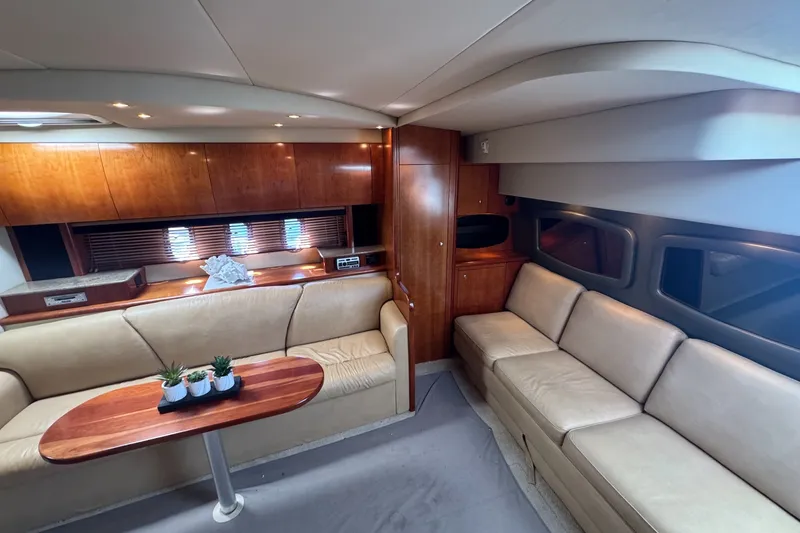 Slide: The Image of Luxurious interior of 2009 Cruisers Yachts 390 Sports Coupe with leather seating and wooden accents. - 17