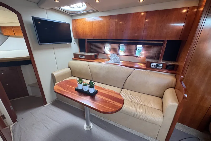 Slide: The Image of Luxurious interior of 2009 Cruisers Yachts 390 Sports Coupe with leather seating and wooden accents. - 19